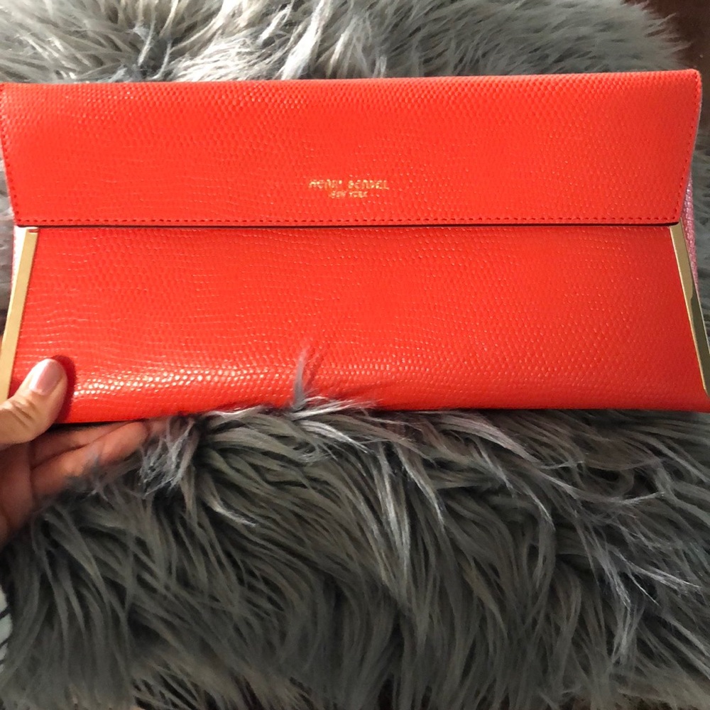 Orange Henri Bendel clutch bag!